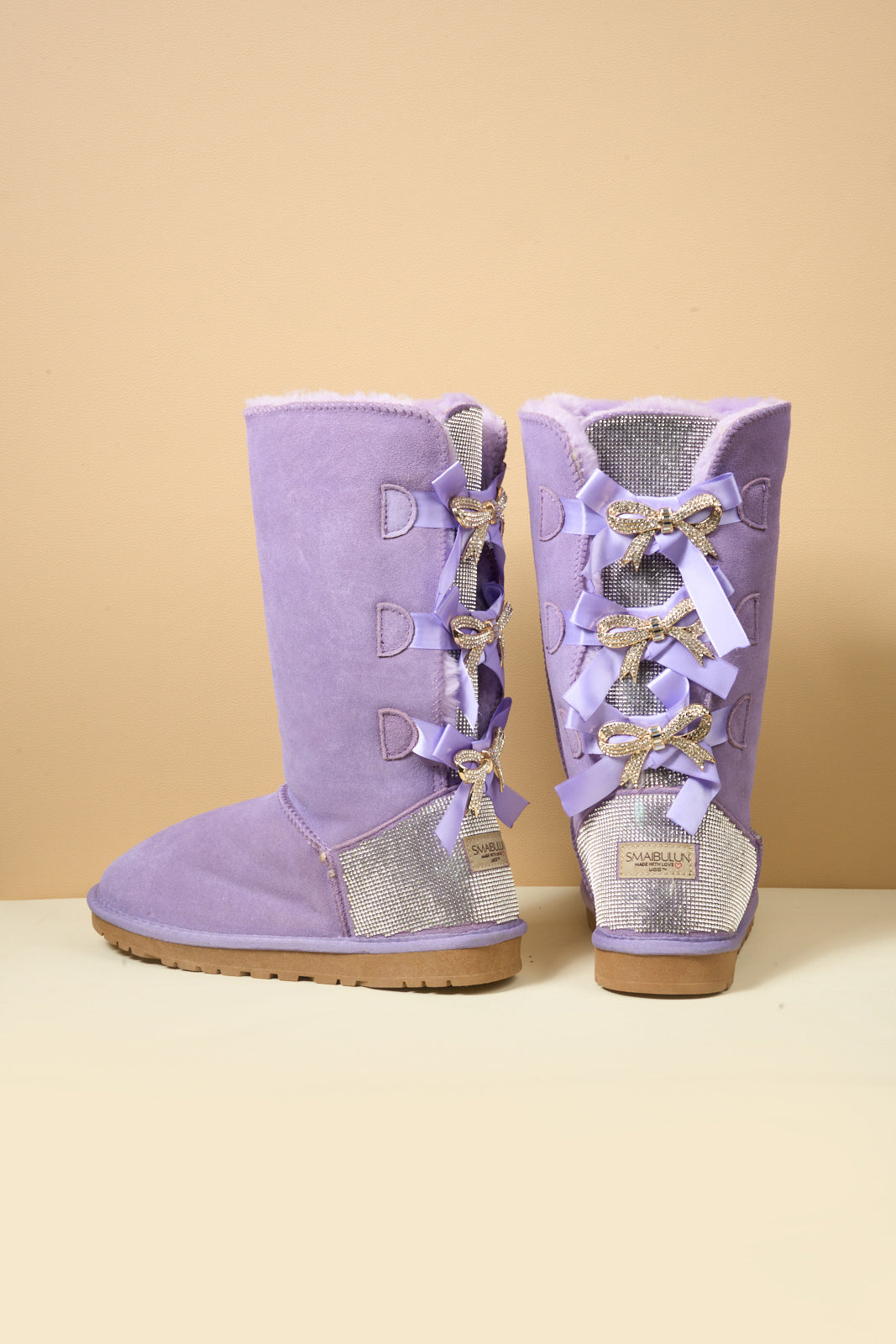 SMAIBULUN Ugg | Rhinestone Ribbon Tri-Tie Bow Suede Boots - lavender