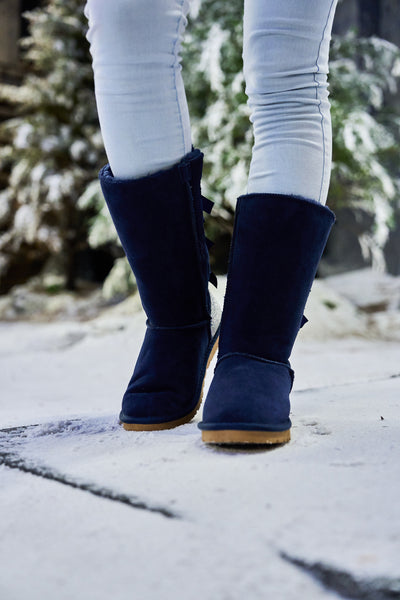 SMAIBULUN Ugg | Rhinestone Ribbon Tri-Tie Bow Suede Boots - Navy