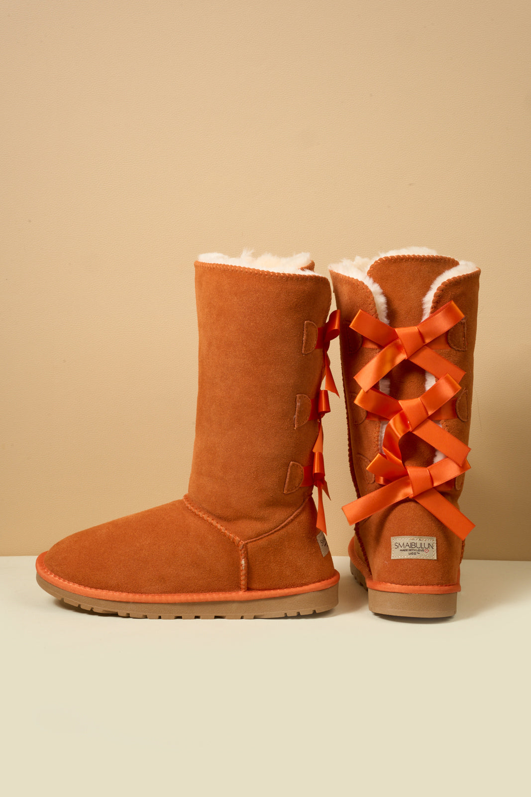 SMAIBULUN Ugg | Tri Ribbon Bow Suede Boots - Orange