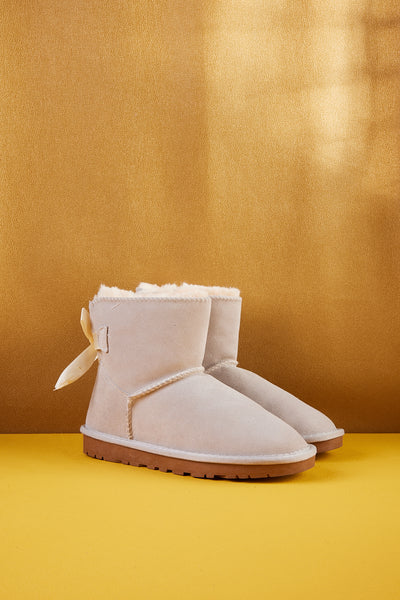 Cream uggs with bows on sale