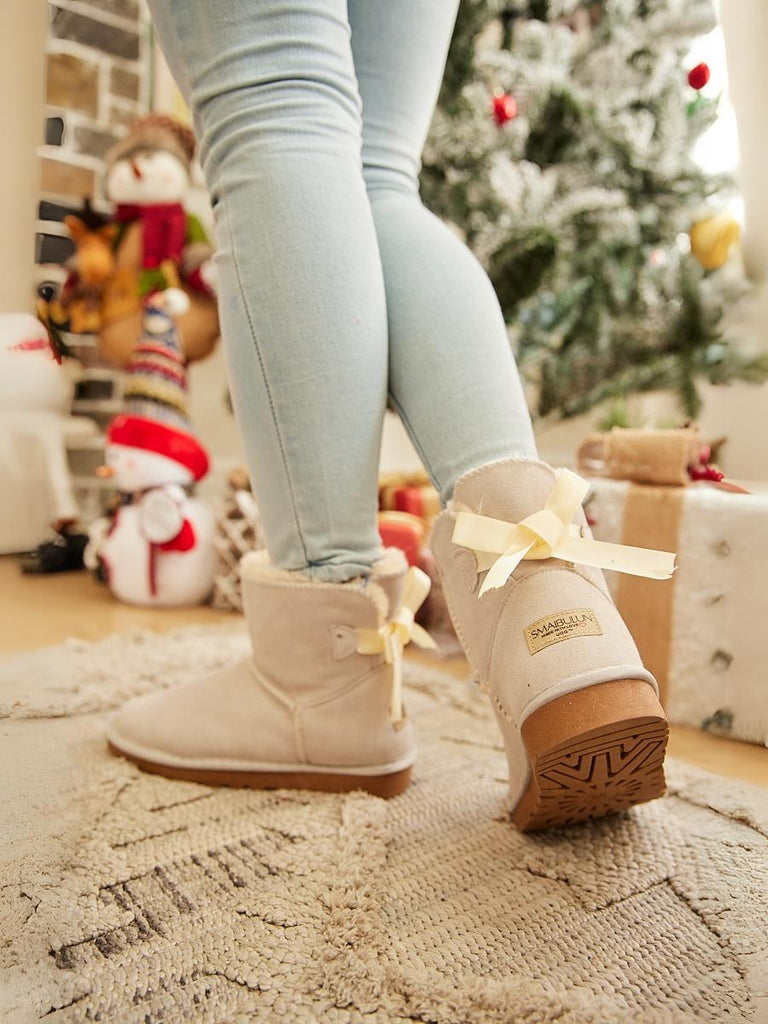 Cream uggs with bows on sale