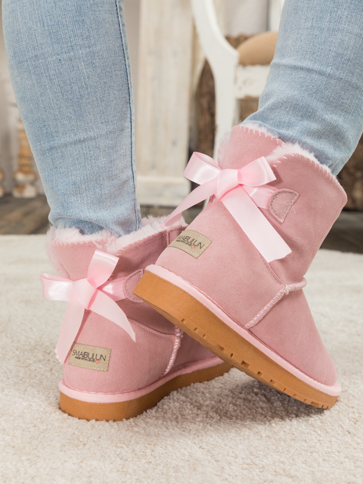 Red uggs with ribbon shops on back